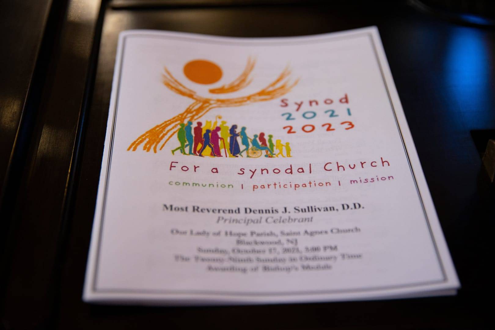 A program for a Mass opening the synod process in the Diocese of Camden, N.J., is seen at St. Agnes Church of Our Lady of Hope Parish in Blackwood, N.J., Oct. 17, 2021. (Credit: Dave Hernandez/Catholic Star Herald via CNS.)